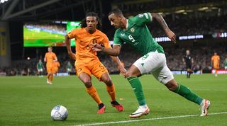 Nathan Ake and Adam Idah challenge for the ball in a Euro 2024 qualifier between Netherlands and Ireland in September 2023.