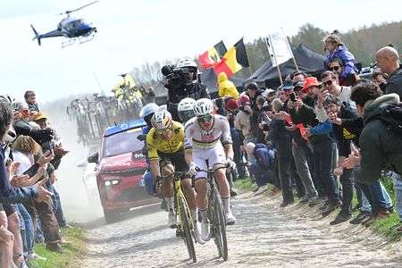 UAE Team Emirates XRG's Slovenian rider Tadej Pogacar cycles in a breakaway on a cobblestone sector ahead of Team Visma - Lease a Bike's Belgian rider Wout van Aert during the 123rd edition of the Paris-Roubaix one-day classic cycling race, 258.3 km between Compi&egrave;gne and Roubaix, northern France, on April 12, 2026. (Photo by Bernard PAPON / POOL / AFP)
