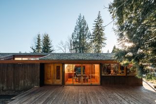 the perry estate by arthur erickson clad in timber and its low volume among wooded surrounds