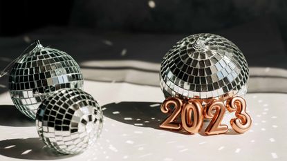small disco balls lit up with 2023 