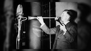 A musician from the British Army plays a trumpet found in King Tutankhamun's burial on a Cairo radio microphone in the Egyptian Museum on April 19, 1939.