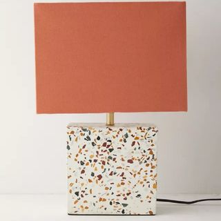 A terrazzo marble-based table lamp
