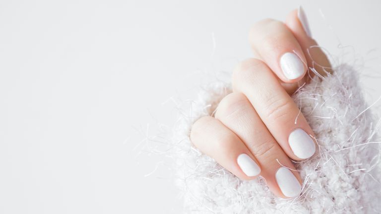 milky white nails color, tiktok trend, white mani, white fuzzy sweater, white background