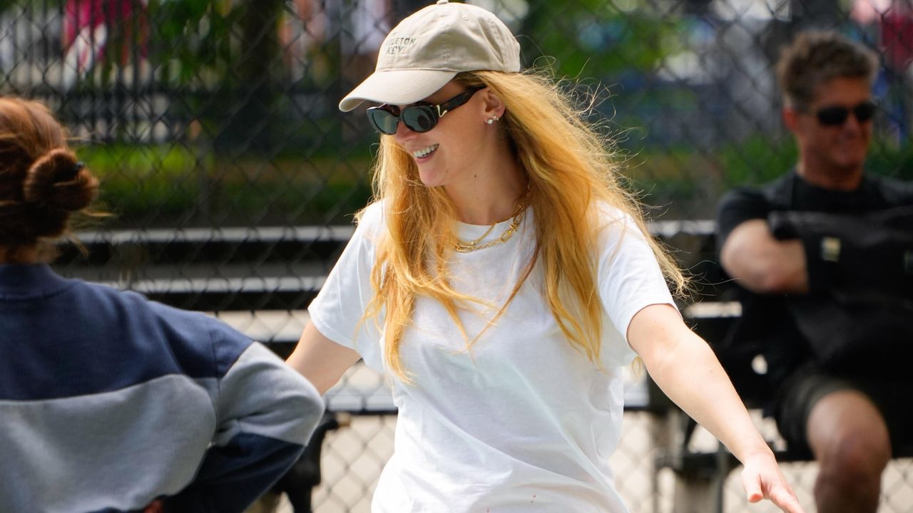 jennifer lawrence wearing a t shirt and boxer shorts to the playground