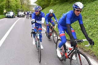 Thibaut Pinot checks his arm as he picks himself up after the crash