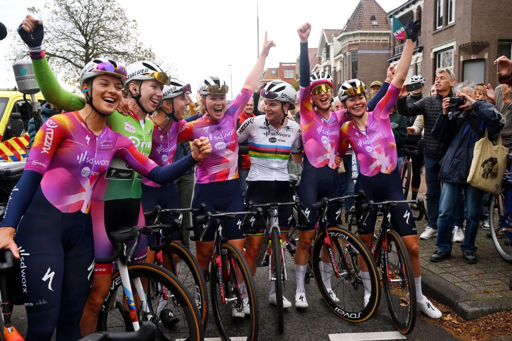 ARNHEM, NETHERLANDS - OCTOBER 13: Stage and overall winner and Lotte Kopecky of Belgium (C), Lorena Wiebes of The Netherlands - Green Points Jersey, Femke Gerritse of The Netherlands, Barbara Guarischi of Italy, Christine Majerus of Luxembourg, Femke Markus of The Netherlands, Lonneke Uneken of The Netherlands and Team SD Worx - Protime celebrate after the 26th Simac Ladies Tour 2024, Stage 6 a 145.8km stage from Arnhem to Arnhem / #UCIWWT / on October 13, 2024 in Arnhem, Netherlands. (Photo by Luc Claessen/Getty Images)