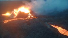 A volcano pouring lava into the surrounding area