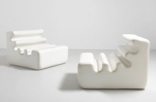 Two white chairs with wriggly surface by Liisi Beckmann