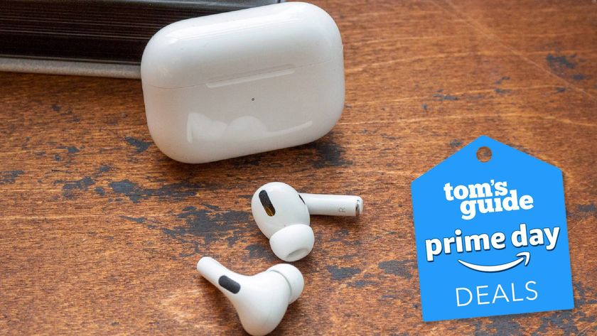 AirPods Pro on a table with a Tom&#039;s Guide deal tag