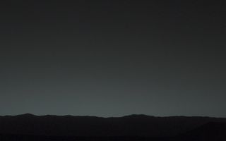 This view of the twilight sky and Martian horizon taken by NASA's Curiosity Mars rover includes Earth as the brightest point of light in the night sky. Earth is a little left of center in the image, and our moon is just below Earth. The Curiosity rover snapped the photo on Jan. 31, 2014.