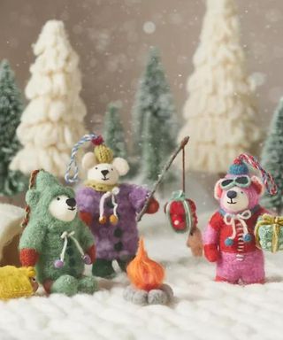 Handmade Felt Bear Ornaments against a snowscape.