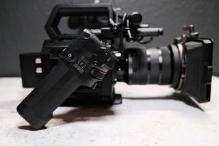 Blackmagic Pyxis 6K camera with lens attached on a white table