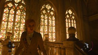 Alone in the Dark; a woman stands in front of stained glass windows