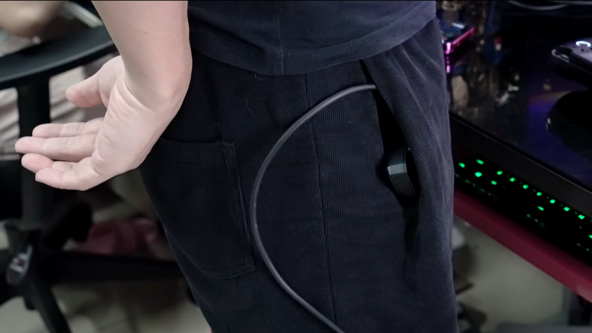 A screenshot of a video from GPD showing off it's new battery optional Strix Halo handheld