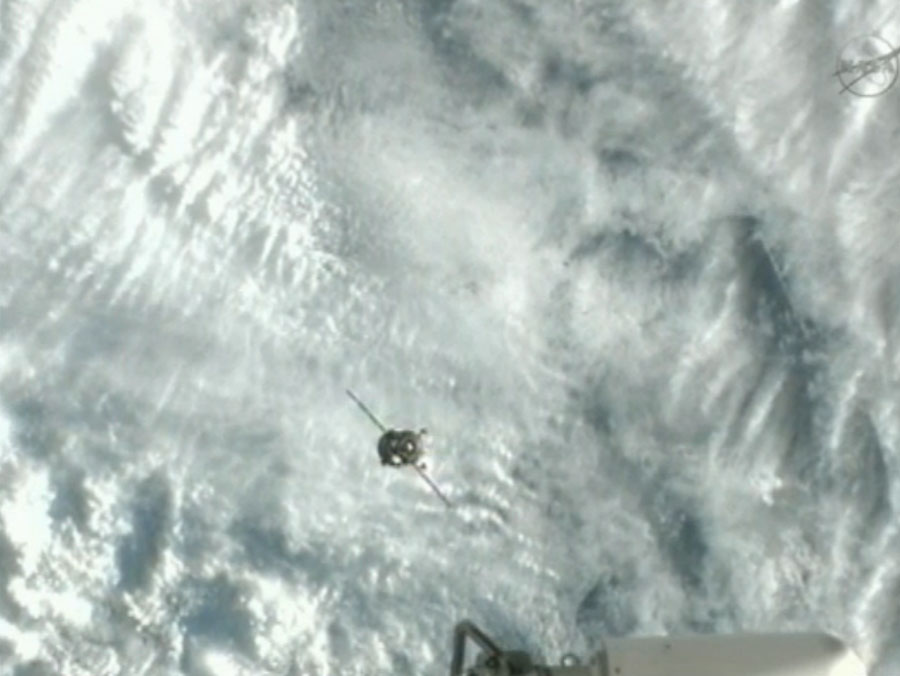 The Soyuz TMA-07M spacecraft approaches the International Space Station for docking Dec. 21, carrying three new crewmembers for the Expedition 34 mission.