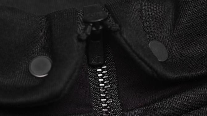 The Kings of Pain jersey has a unique fold-down collar with snaps