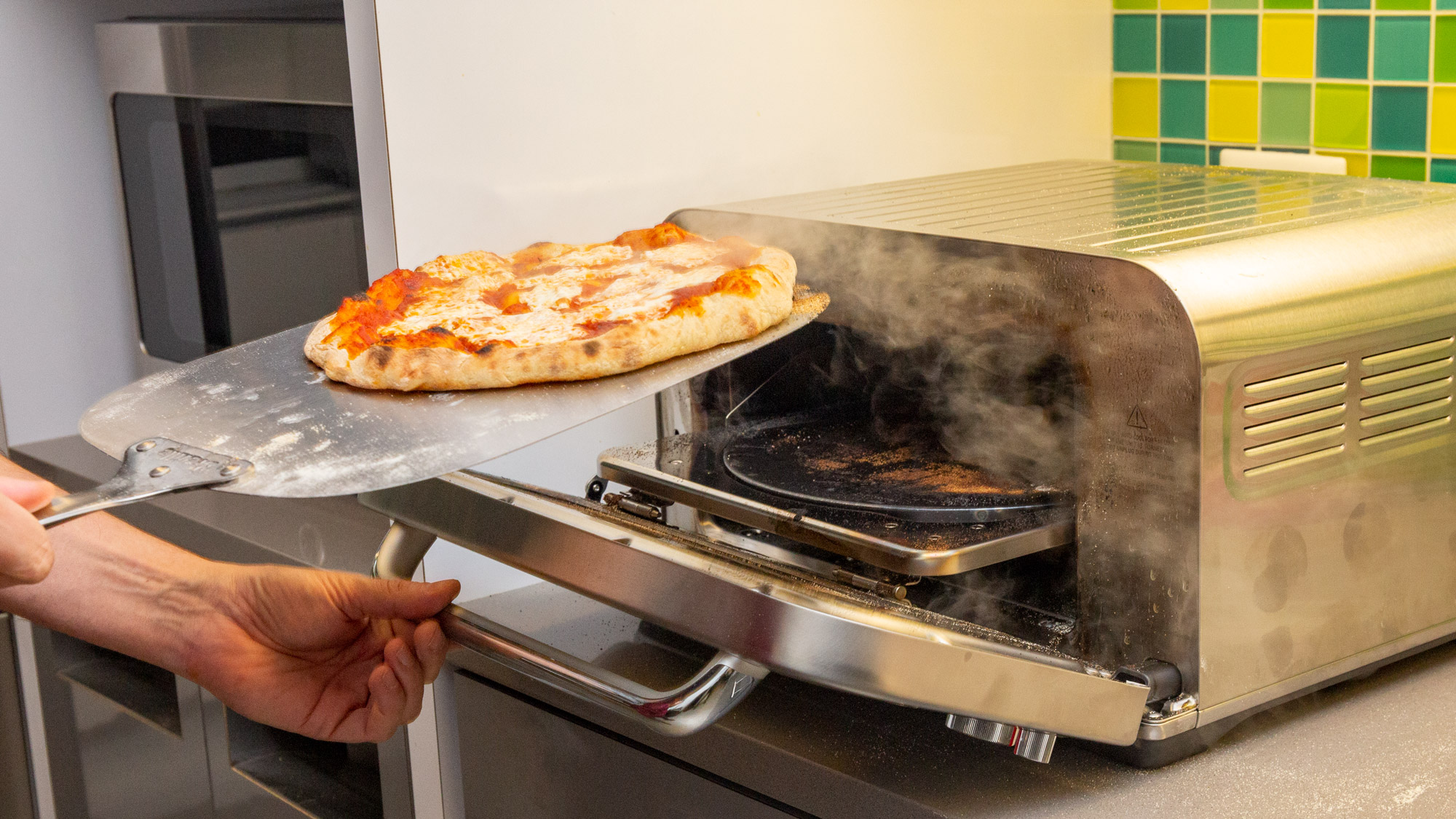 Breville Pizza Oven with handheld pizza