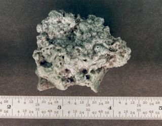 Solid rocket motor (SRM) slag. Aluminum oxide slag is a byproduct of SRMs. Orbital SRMs used to boost satellites into higher orbits are potentially a significant source of centimeter sized orbital debris. This piece was recovered from a test firing of a S