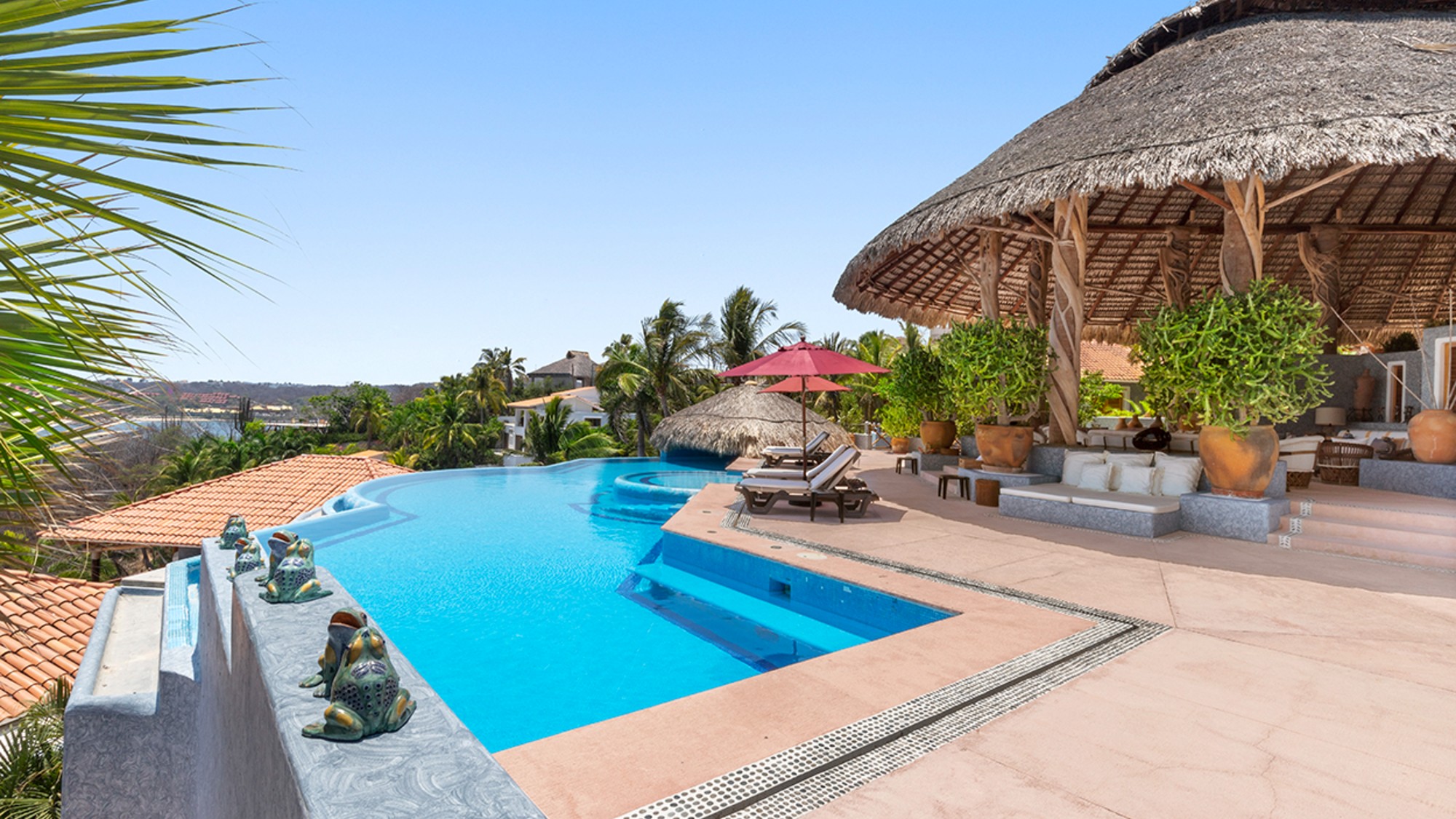 Overlooking the Gulf of Tehuantepec in a coastal town, this 1993, eight-bedroom estate has Mediterranean and Balinese influences across multiple structures.