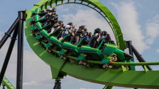 A train of fans riding through a loop in Green Lantern.