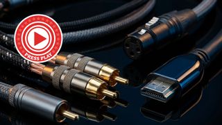 Picture of some cables with gold connectors in moody lighting with a Press Play roundel in the top left hand corner