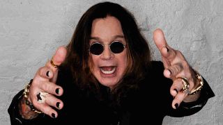 Ozzy Osbourne posing for a photograph in 2009