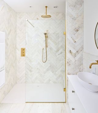 bathroom with gold shower screen and fittings