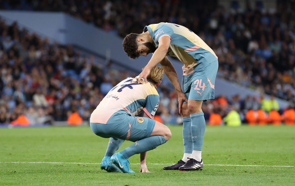 Josko Guardiol of Manchester City checks on Kevin De Bruyne who was injured during the 2024/25 UEFA Champions League MD1 match between Manchester City and Internazionale Milano at the Etihad Stadium on September 18, 2024 in Manchester, England.