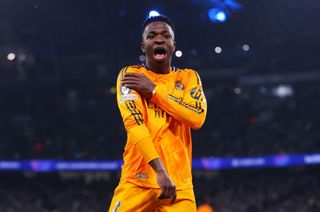 Vinicius Junior of Real Madrid celebrates after scoring their team's second goal during the UEFA Champions League 2024/25 League Knockout Play-off first leg match between Manchester City and Real Madrid C.F. at Manchester City Stadium on February 11, 2025 in Manchester, England.