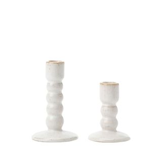 two ceramic candle holders with rounded rings, different heights, in cream