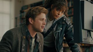 Leo Woodard and Quintessa Swindell stare at a computer screen