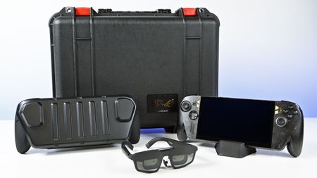 ROG Ally X20 bundle display with the handheld on a stand, XREAL AR glasses, dbrand Killswitch cover, and Pelican case.