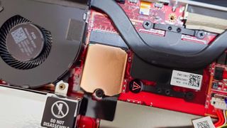 A copper heatsink applied to the SSD inside the ROG Ally.