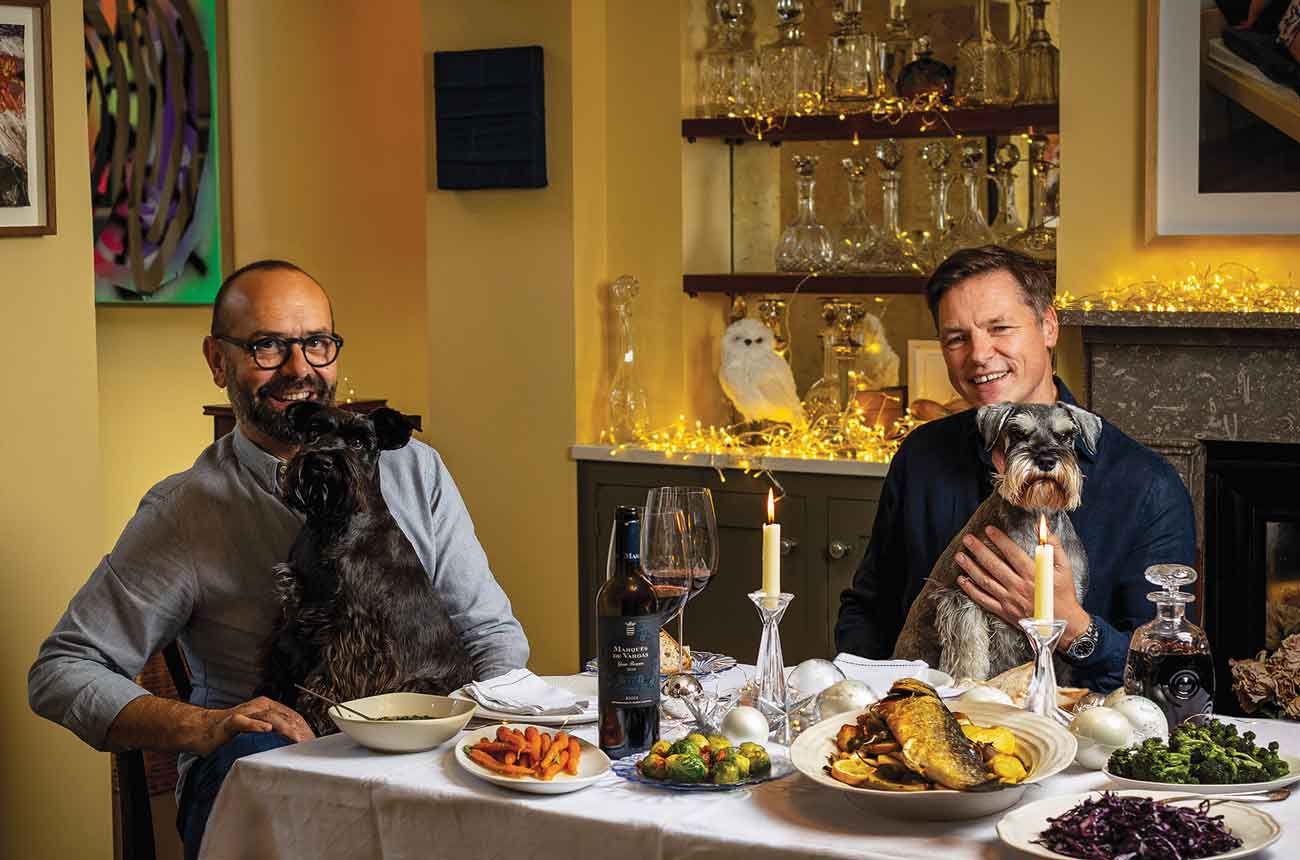 Jos&amp;eacute; Pizarro and husband Peter with dogs at Christmas meal