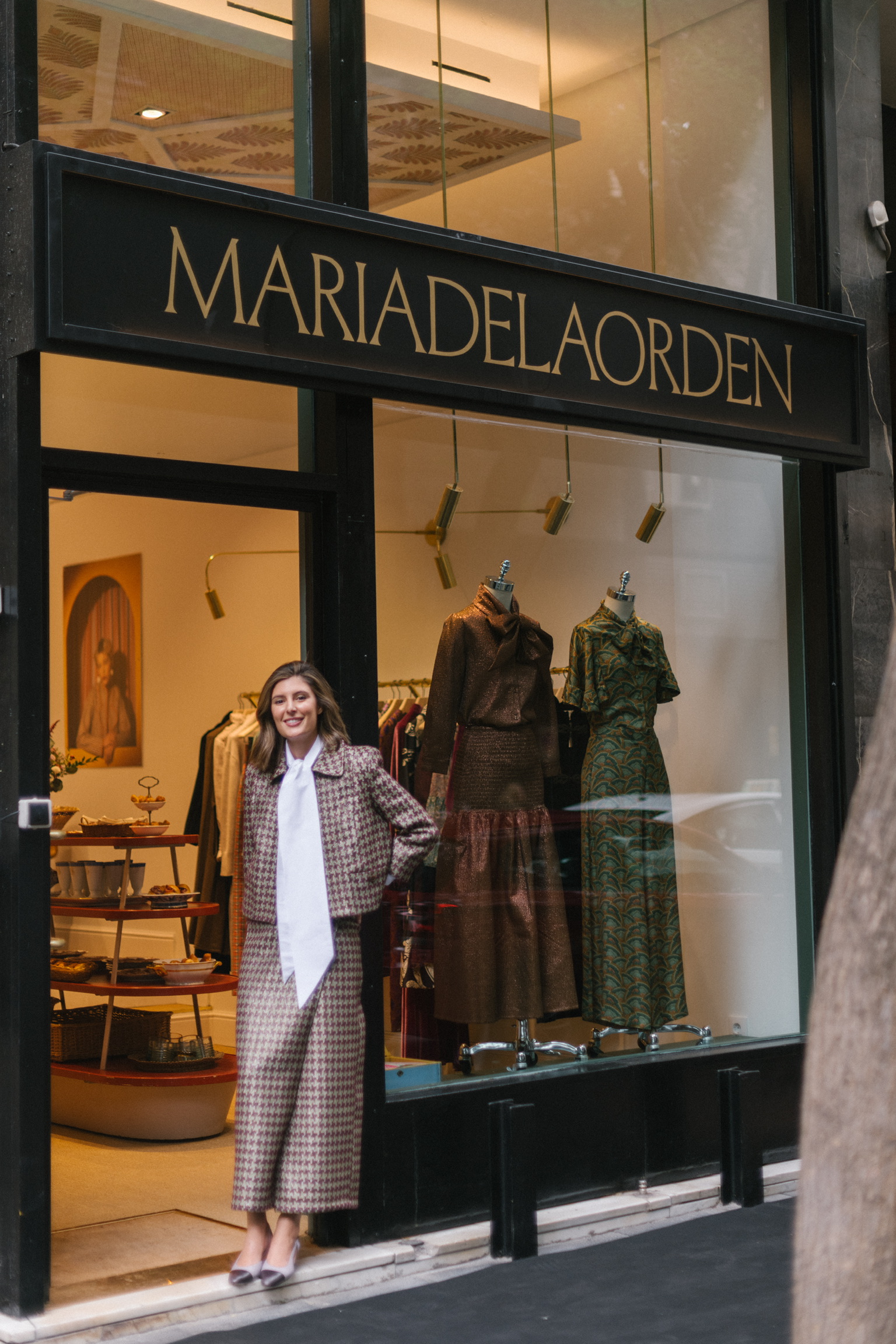 maria de la orden in front of her store