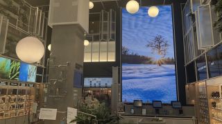 The content shown on the NanoLumens LED display keeps with the store’s design influences, presenting images of flowing landscapes and nature scenes.