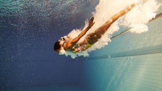 Woman swimming in pool