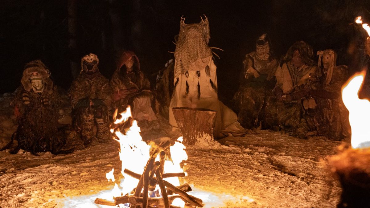 Antler Queen and others around fire in Yellowjackets