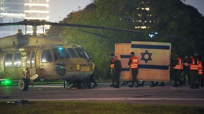 A helicopter arrives with freed Israeli hostages