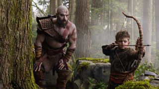 Ryan Hurst as Kratos and Callum Vinson as Atreus holding a bow in God of War