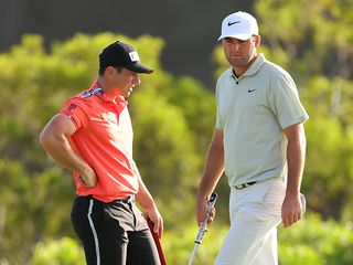 Scottie Scheffler and Viktor Hovland standing next to each-other on the golf course