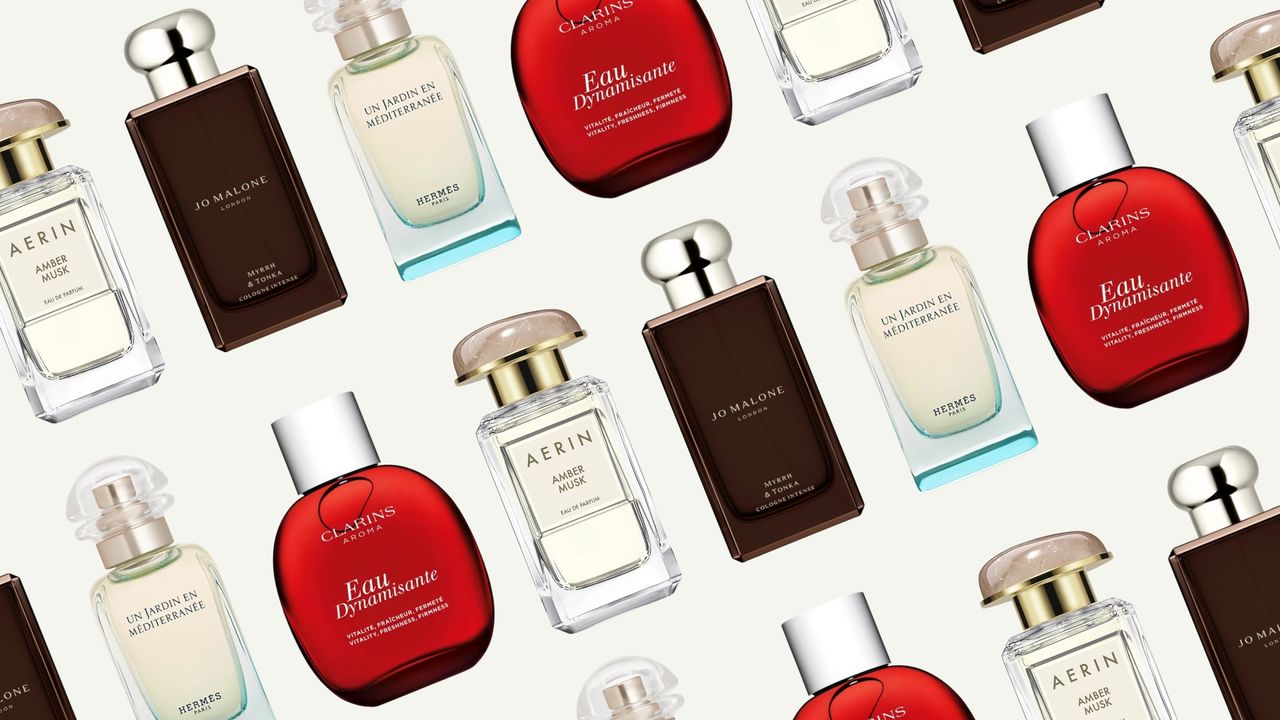 A collage of perfumes including AERIN&#039;s Amber Musk, Jo Malone&#039;s Myrrh &amp; Tonka, Clarins Eau Dynamisante and Hermès Un Jardin en Méditerranée, all arranged in a repeated, diagonal line pattern and on a cream background