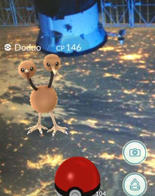 A computer-animated Pokemon, a bird with two heads, floats over an image shot from the International Space Station in a smartphone interface