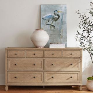 Sausalito 8 Drawer Dresser against a gray wall.