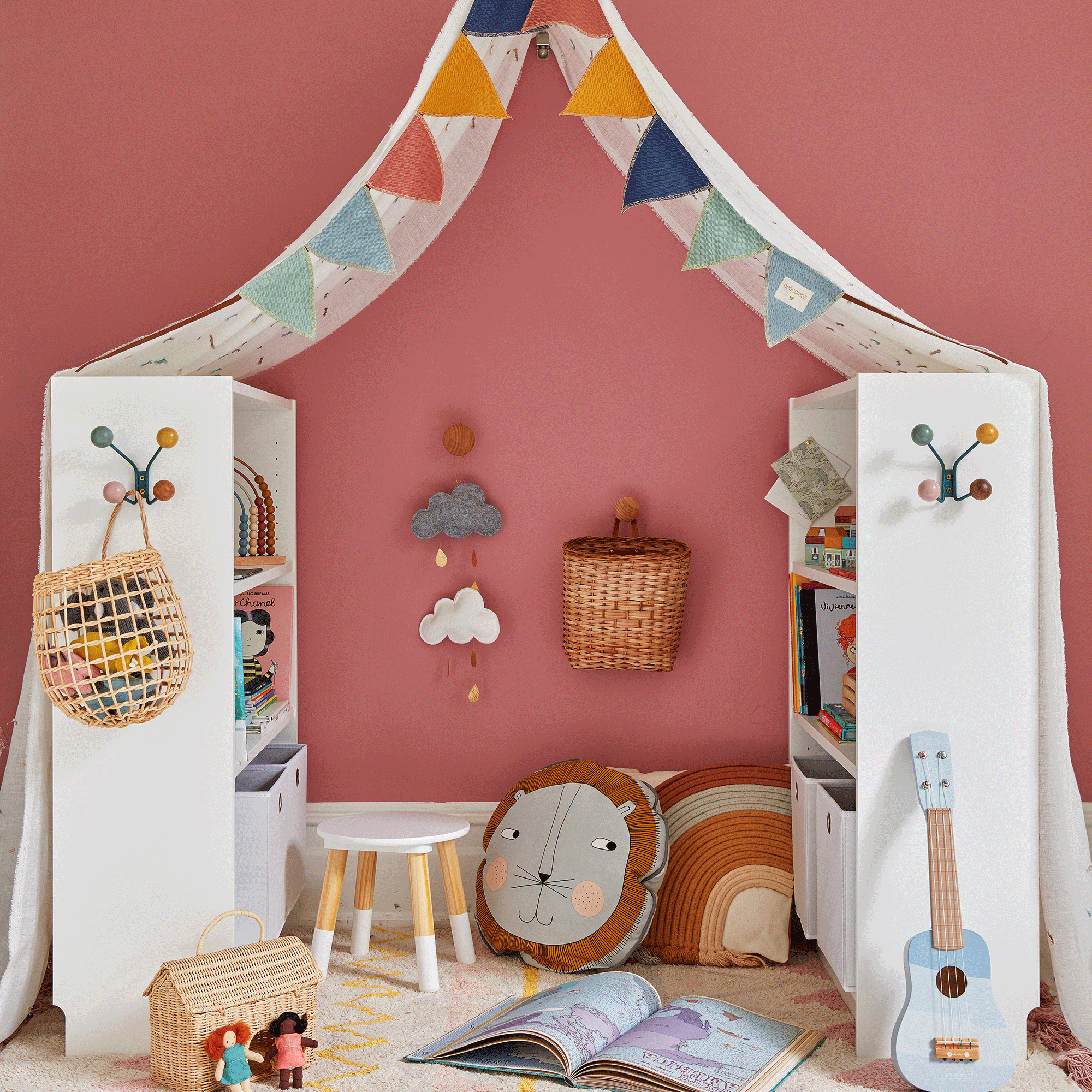 Kids room with pink walls and shelves