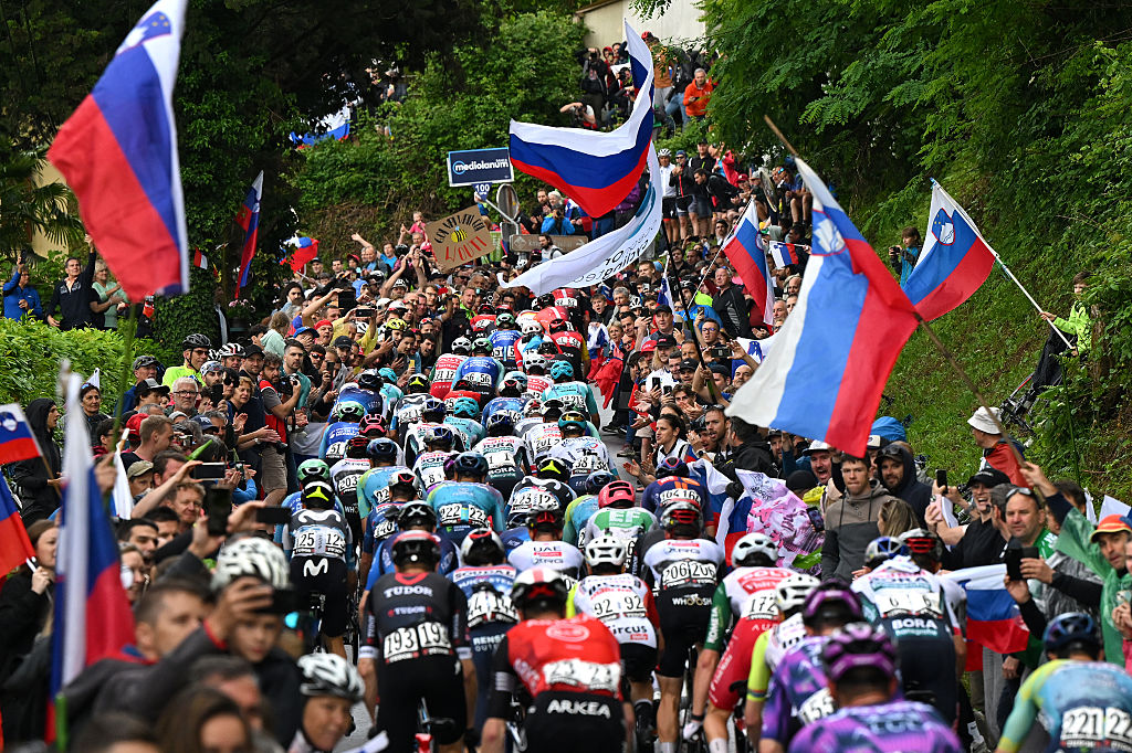 NOVA GORICA ITALY MAY 24 A general view of the peloton competing while fans cheer during the 108th Giro dItalia 2025 Stage 14 a 195km stage from Treviso to Nova Gorica UCIWT on May 24 2025 in Nova Gorica Italy Photo by Dario BelingheriGetty Images