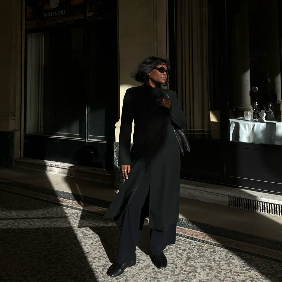 Franny fyne wears an all black outfit