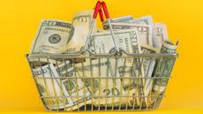 A metal basket filled with cash.