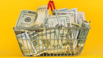 A metal basket filled with cash.