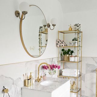 white bathroom with mirror and shelf